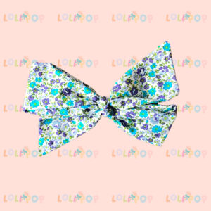 MOÑO LAZO FLOR MORADO Y VERDE